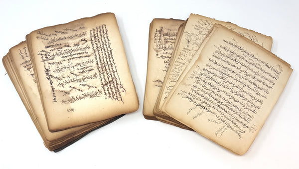 Arabic devotional manuscript showing loose leaves with extensive marginal annotations and a prose section.