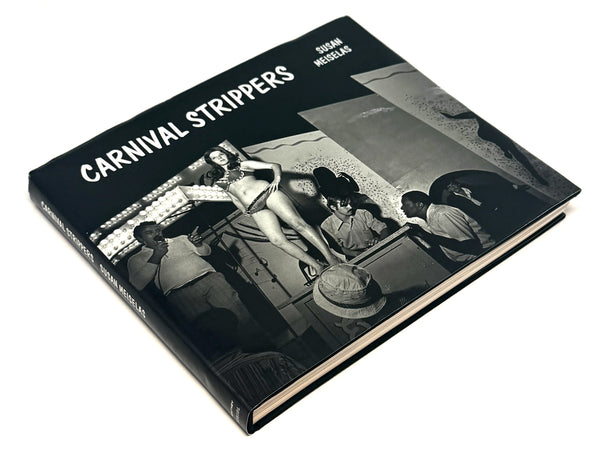 Carnival Strippers by Susan Meiselas, 2003 revised edition: angled front dust jacket view